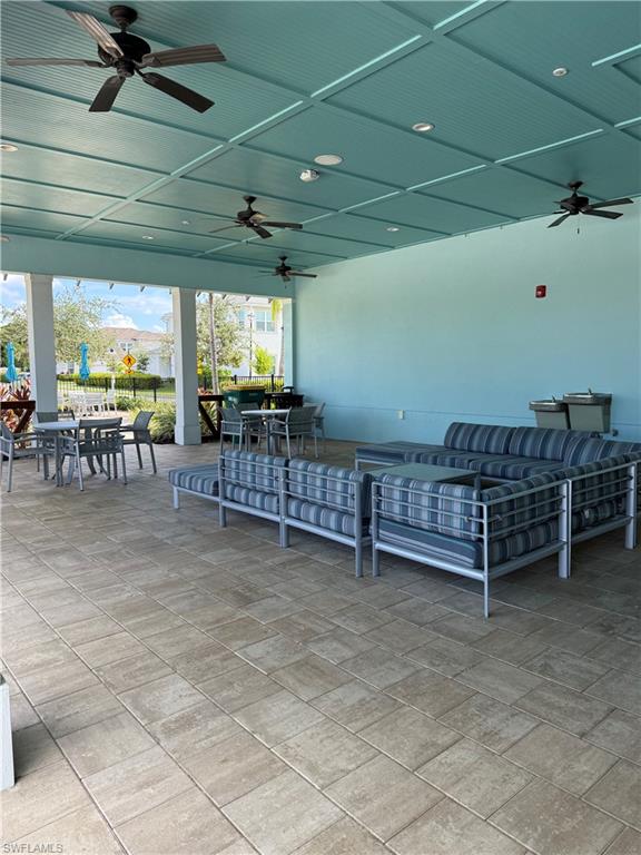4721 Arboretum Circle, Unit 201 Naples, FL 34112 - Photo 21 of 26 a view of a room with lots of furniture and a projector
