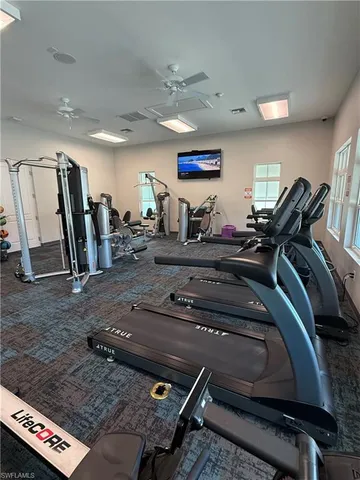a view of a room with lots of furniture and a projector