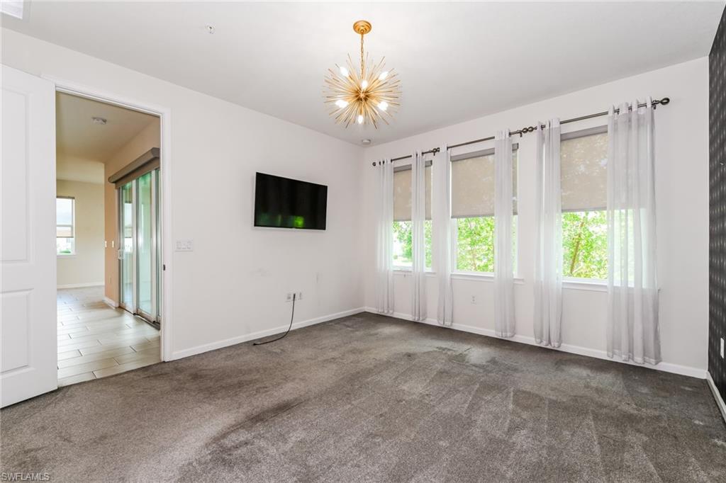 4721 Arboretum Circle, Unit 201 Naples, FL 34112 - Photo 8 of 26 a view of an empty room with a window