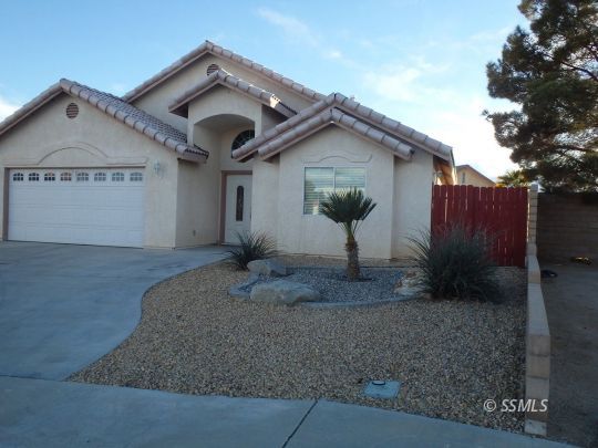 421 Marlene Court Ridgecrest, CA 93555 - Photo 2 of 50 a front view of a house with a yard and garage