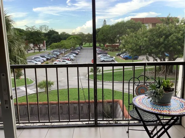 a view of a balcony with lake view and mountain view