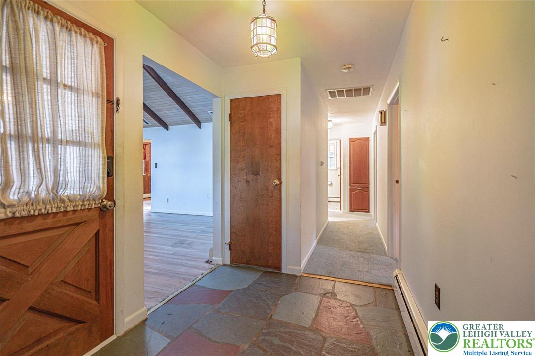258 Kohlers Hill Road Kutztown, PA 19530 - Photo 11 of 60 a view of a hallway with wooden floor and windows