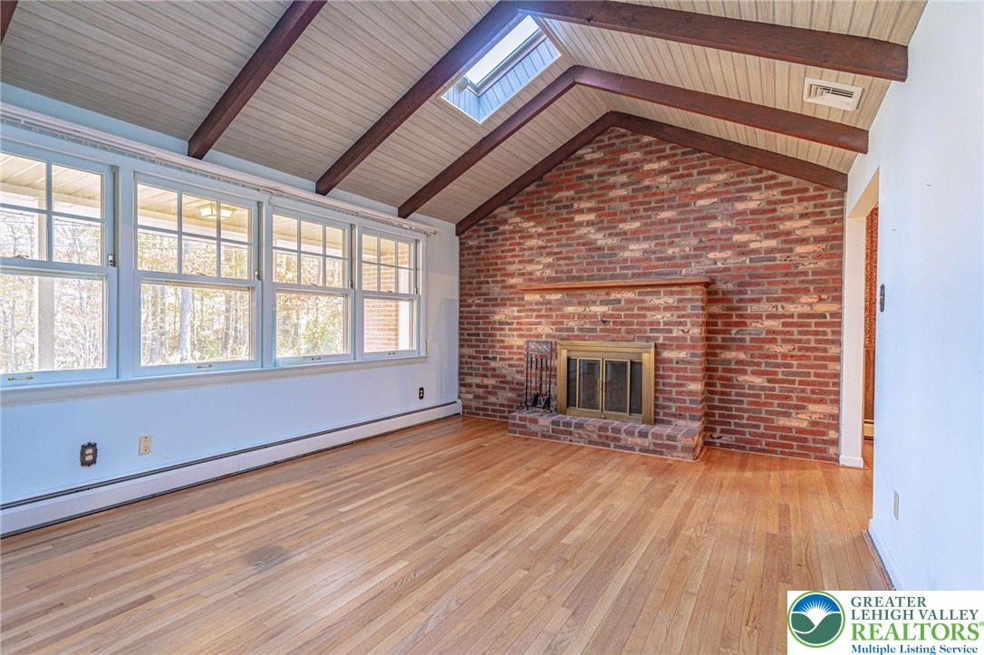 258 Kohlers Hill Road Kutztown, PA 19530 - Photo 13 of 60 a view of an empty room with wooden floor and a window