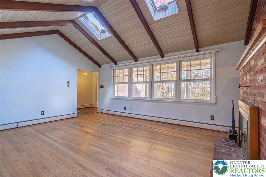 258 Kohlers Hill Road Kutztown, PA 19530 - Photo 14 of 60 a view of an empty room with wooden floor and a window
