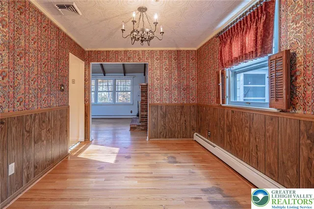 a kitchen with stainless steel appliances granite countertop a refrigerator and cabinets