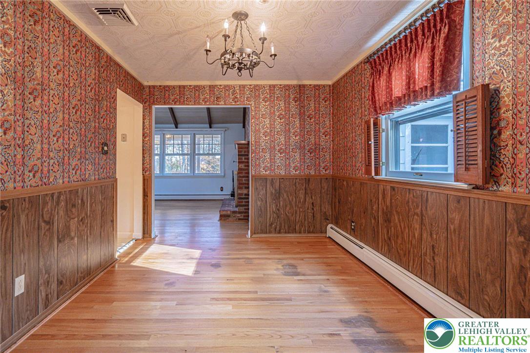258 Kohlers Hill Road Kutztown, PA 19530 - Photo 16 of 60 a view of a hallway with wooden floor and chandelier