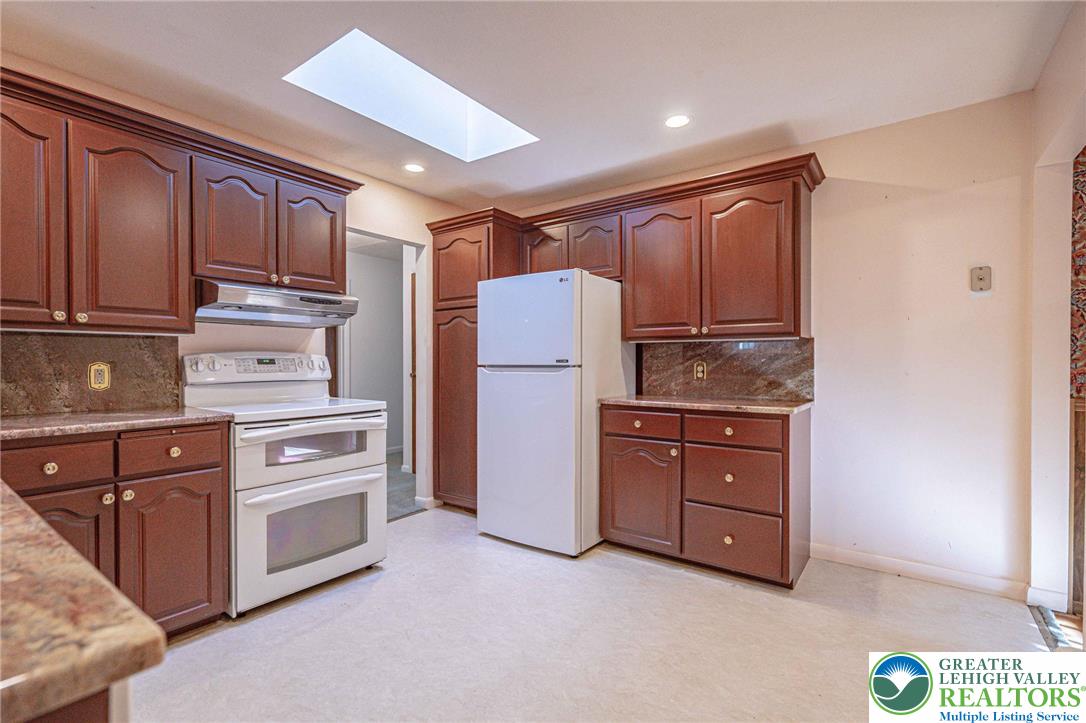 258 Kohlers Hill Road Kutztown, PA 19530 - Photo 19 of 60 a kitchen with stainless steel appliances granite countertop a refrigerator and cabinets