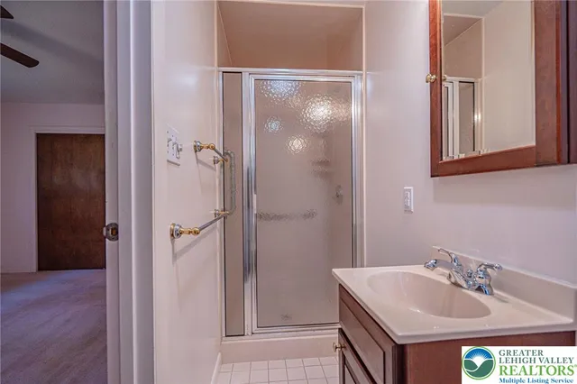 a view of hallway with stairs and wooden floor