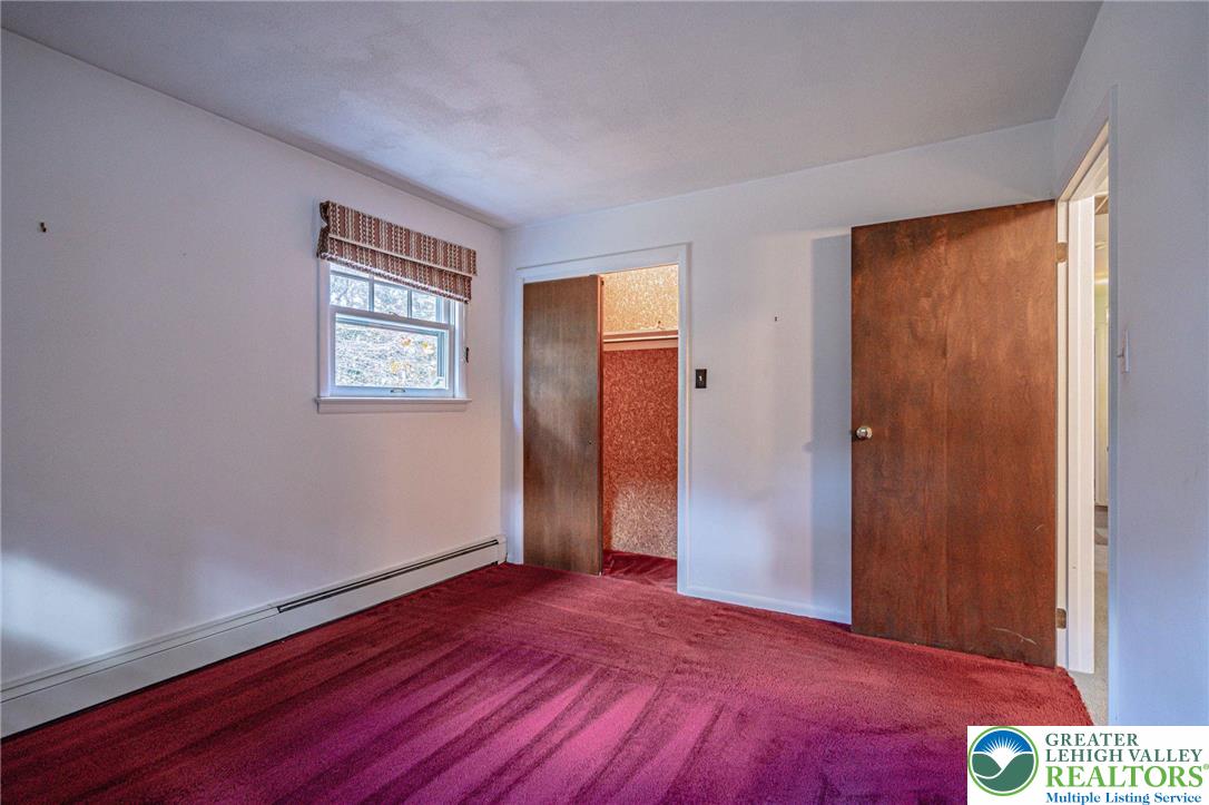 258 Kohlers Hill Road Kutztown, PA 19530 - Photo 33 of 60 a view of an empty room with wooden floor and a window