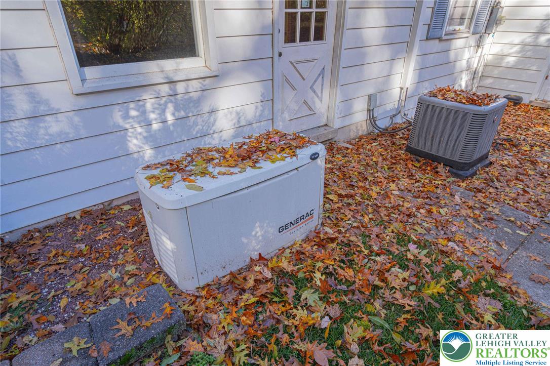 258 Kohlers Hill Road Kutztown, PA 19530 - Photo 45 of 60 a room with water heater and a wooden cabinets