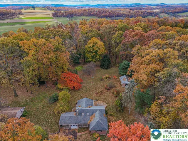 an aerial view of houses with outdoor space
