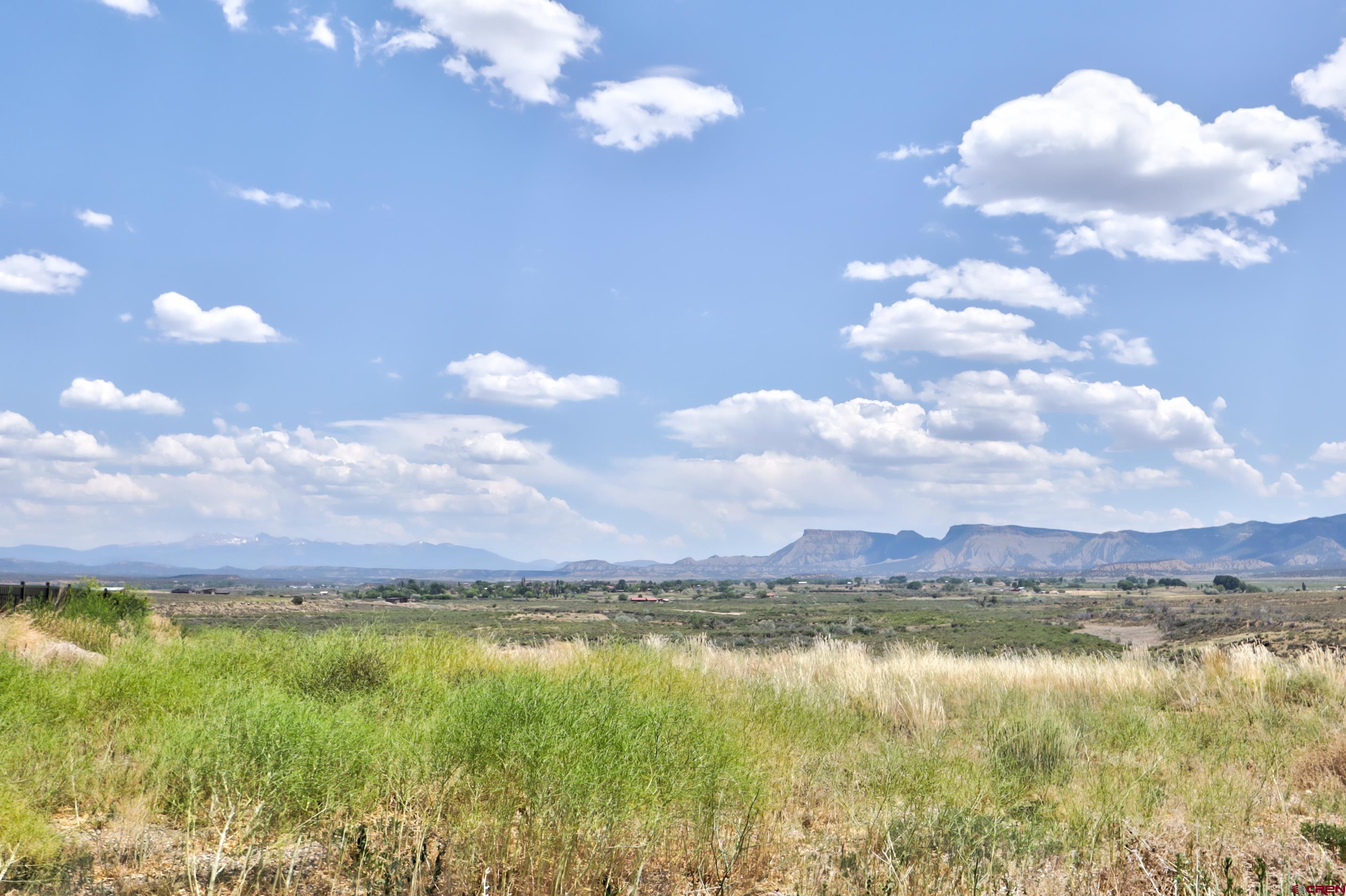 1125 Bluffs Boulevard Cortez, CO 81321 - Photo 22 of 29 a view of a lake and mountain in the back