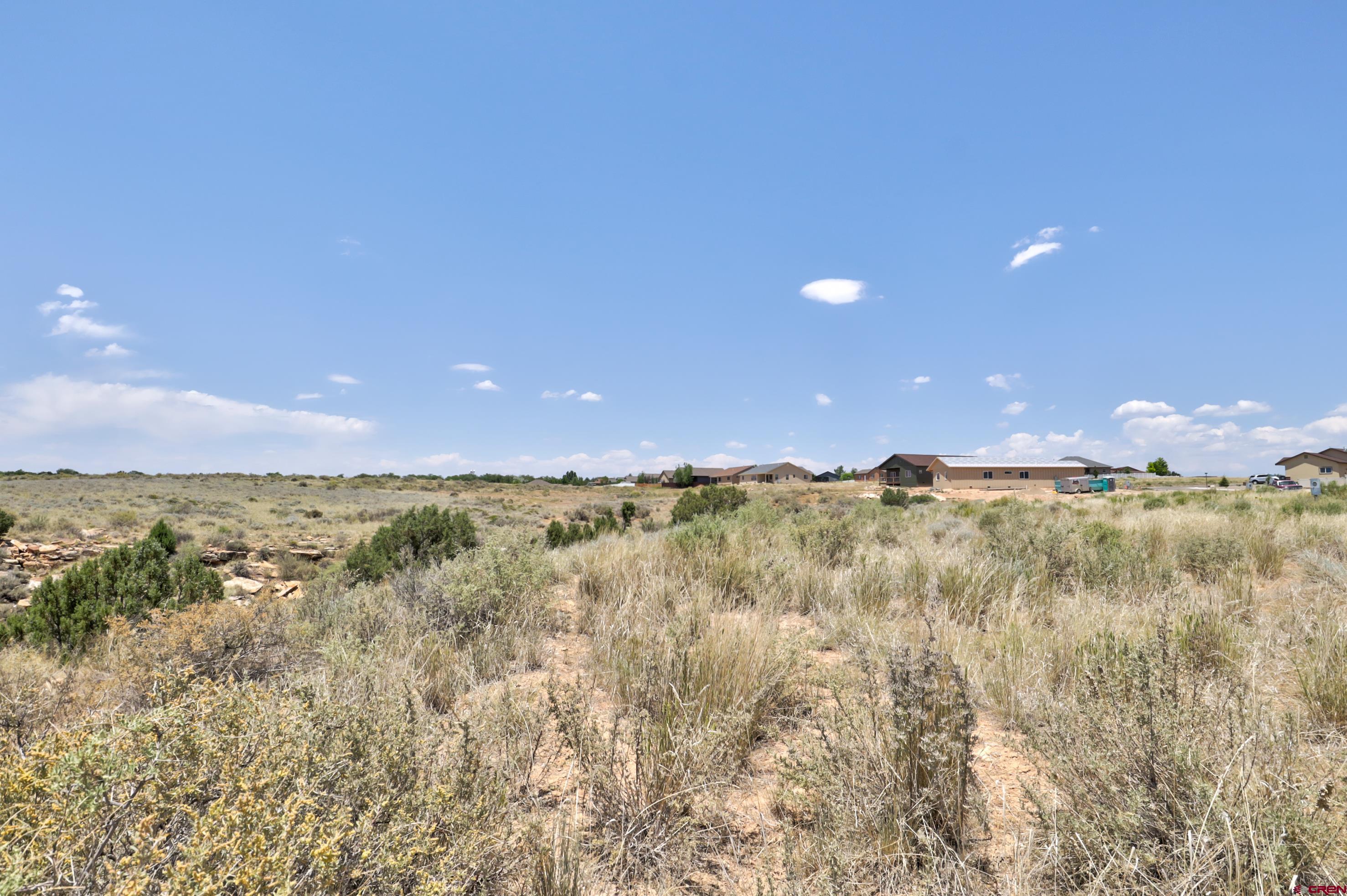 1125 Bluffs Boulevard Cortez, CO 81321 - Photo 23 of 29 a view of lake and mountain