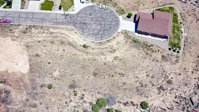 a view of a lake with sunset in the background