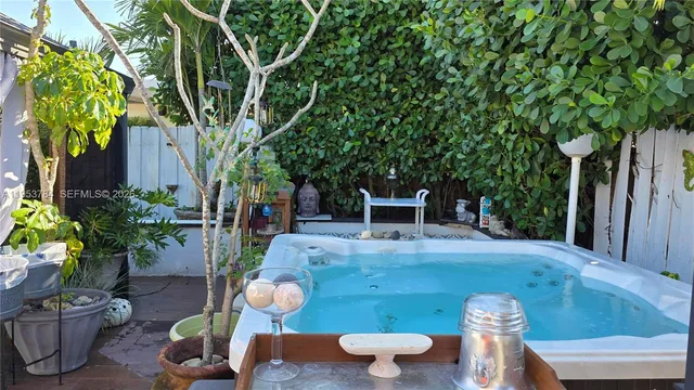 a view of a porch with furniture and a yard