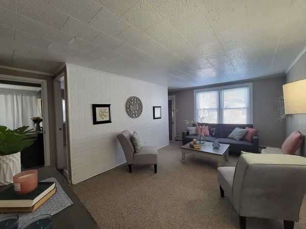 a living room with furniture and a window