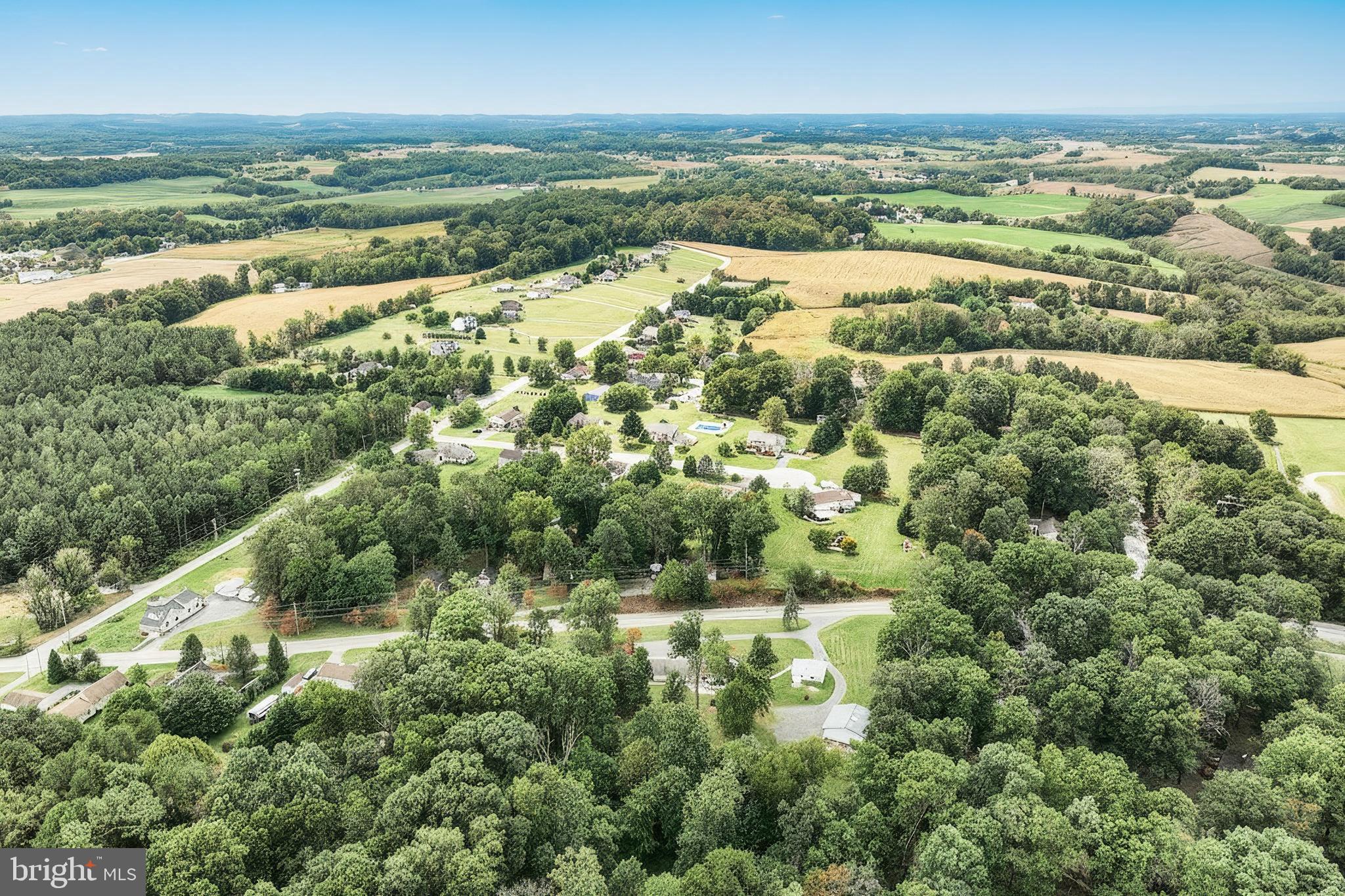 1063 Porters Road Spring Grove, PA 17362 - Photo 12 of 56 an aerial view of residential houses with outdoor space and trees