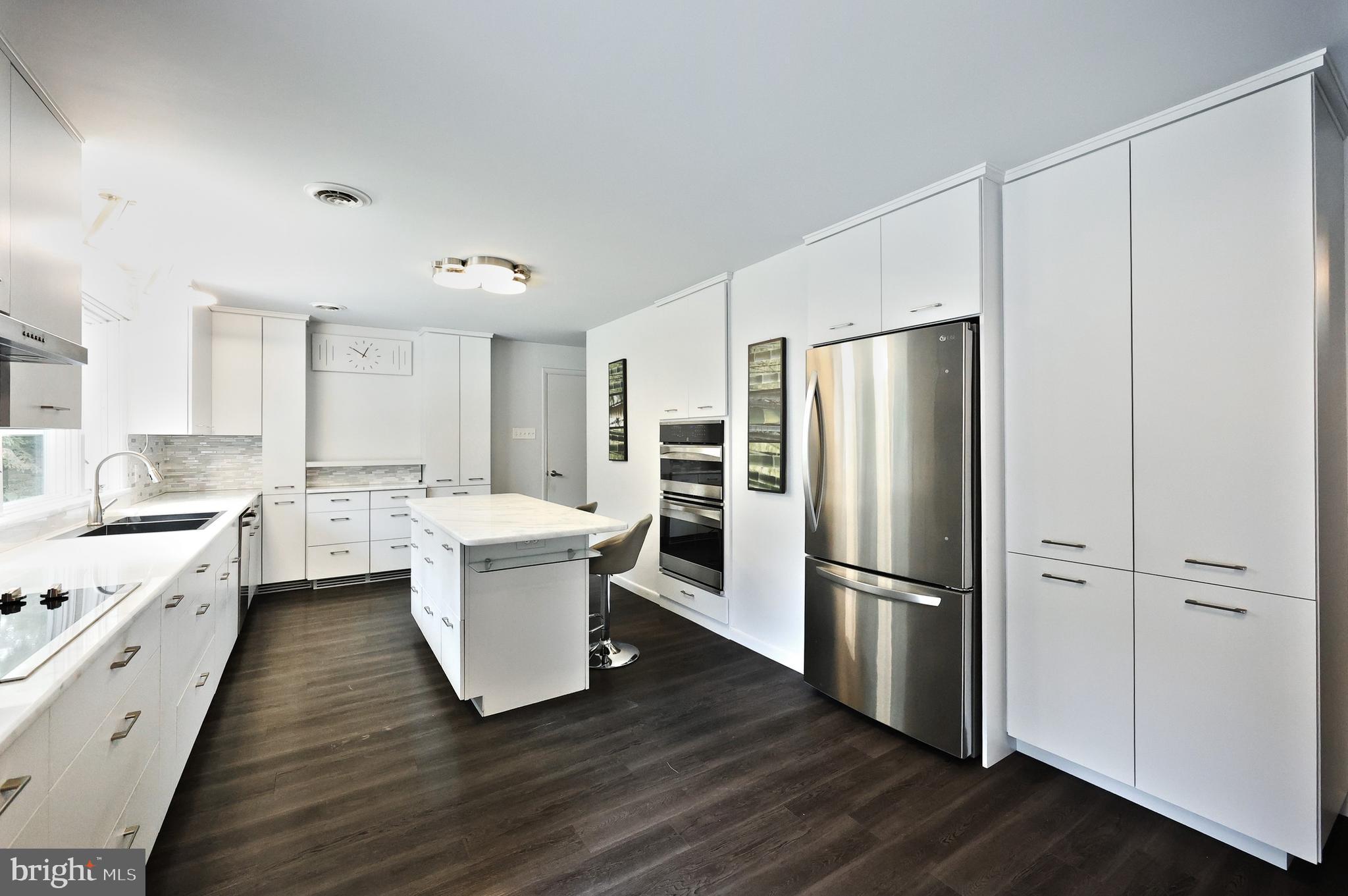 1063 Porters Road Spring Grove, PA 17362 - Photo 22 of 56 a kitchen with a refrigerator sink and cabinets