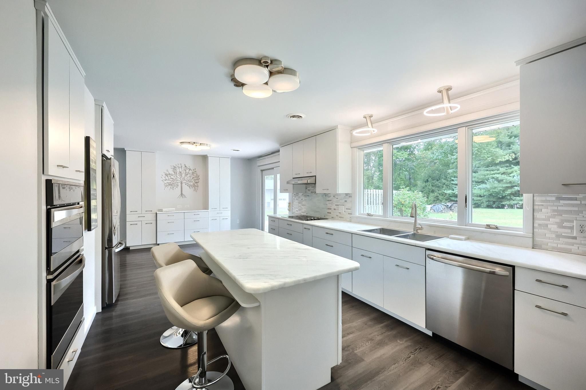1063 Porters Road Spring Grove, PA 17362 - Photo 24 of 56 a kitchen with stainless steel appliances granite countertop a sink and stove