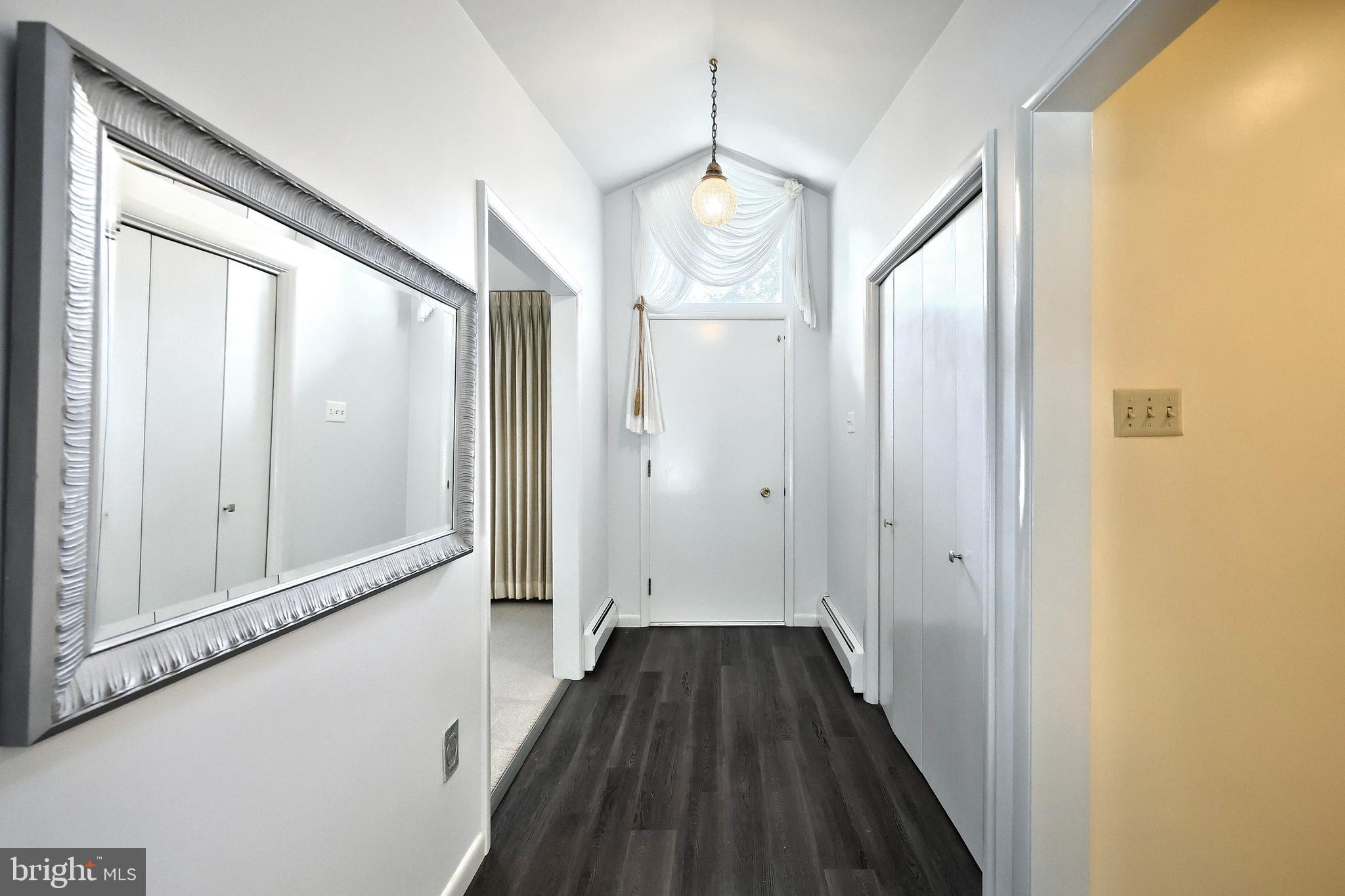 1063 Porters Road Spring Grove, PA 17362 - Photo 27 of 56 a view of a hallway with wooden floor and staircase