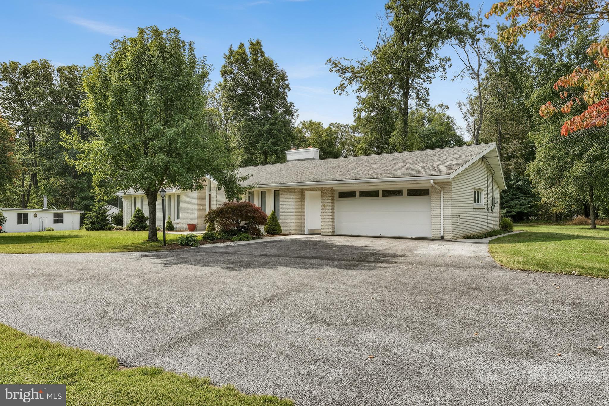 1063 Porters Road Spring Grove, PA 17362 - Photo 3 of 56 a view of a house with a yard and large trees