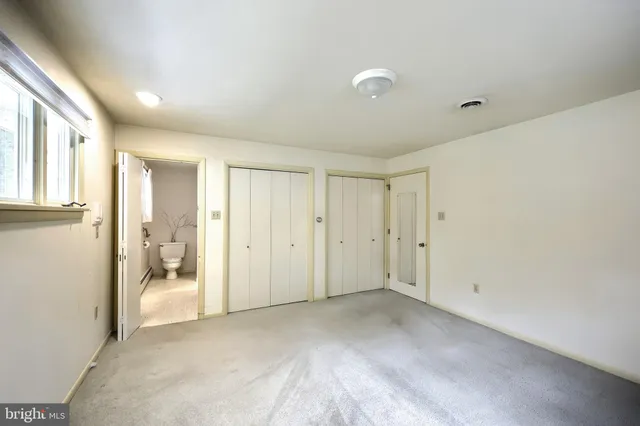a bathroom with a granite countertop toilet a sink and a bathtub