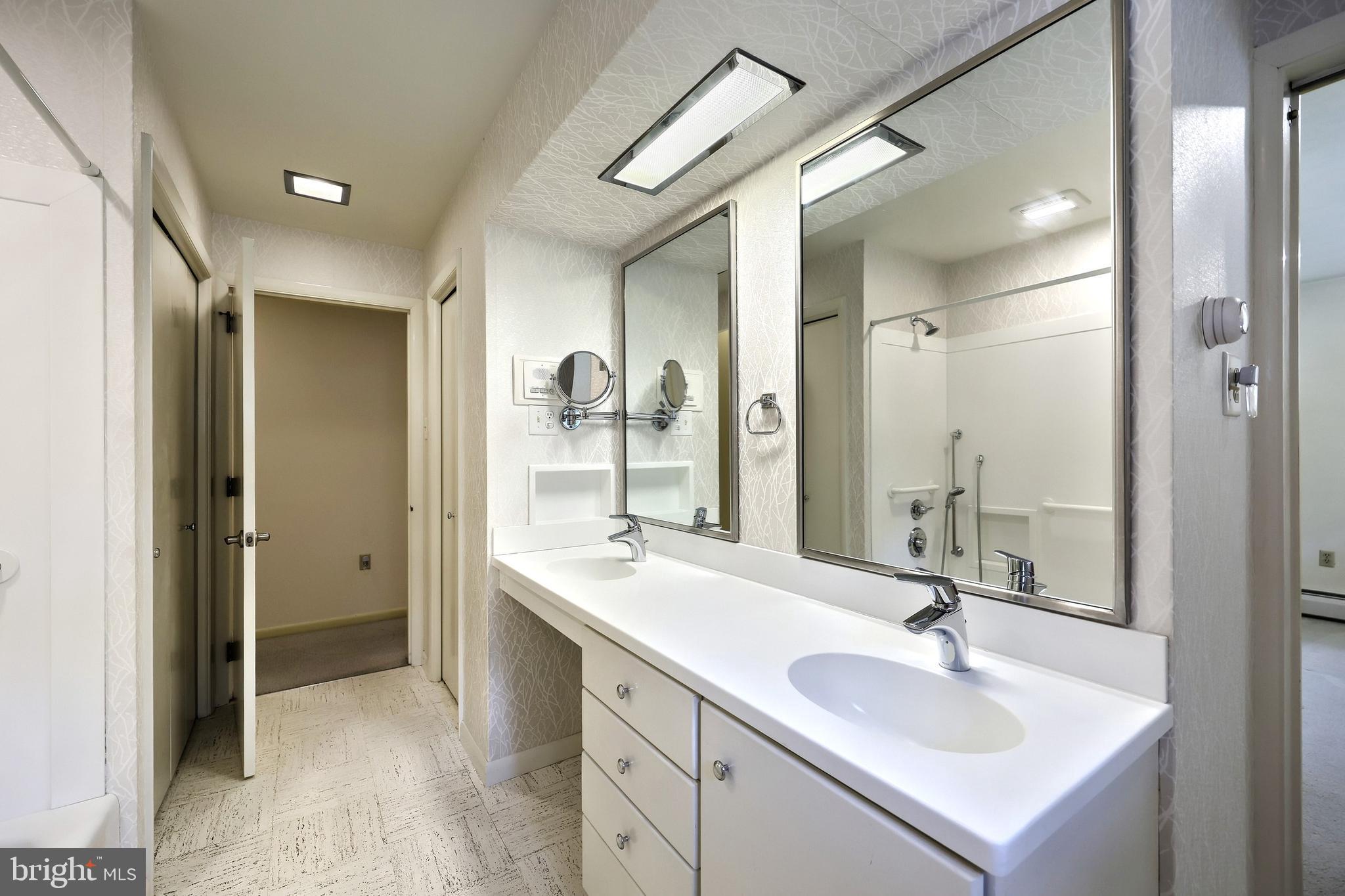 1063 Porters Road Spring Grove, PA 17362 - Photo 36 of 56 a bathroom with a double vanity sink mirror and shower