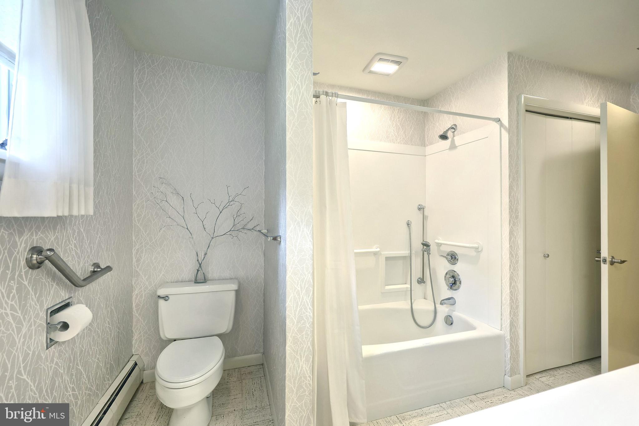 1063 Porters Road Spring Grove, PA 17362 - Photo 37 of 56 a bathroom with a granite countertop toilet a sink and a bathtub