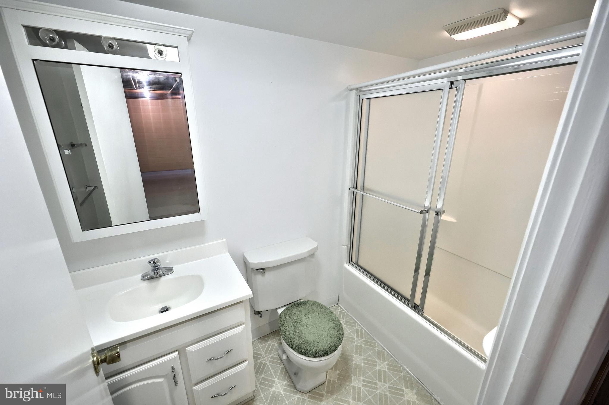 1063 Porters Road Spring Grove, PA 17362 - Photo 43 of 56 a bathroom with a sink a toilet and a mirror