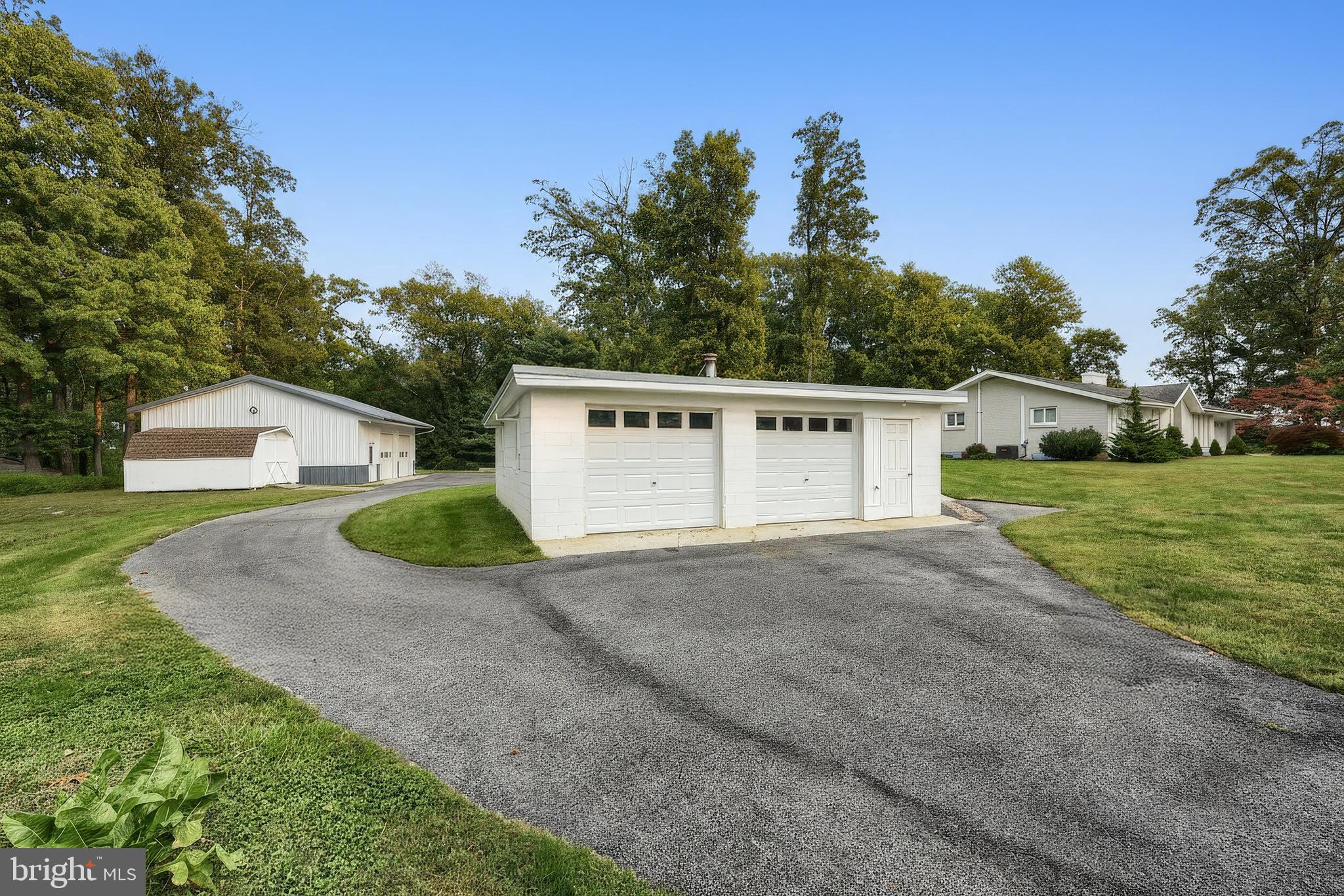 1063 Porters Road Spring Grove, PA 17362 - Photo 52 of 56 a view of a house with a yard and garage