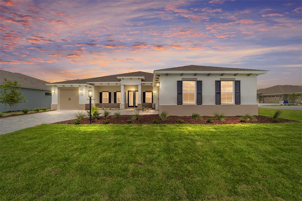 10075 Southwest 84th St Road Ocala, FL 34481 - Photo 1 of 1 a front view of a house with a garden