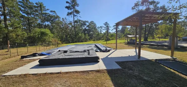 a view of a swimming pool with a patio