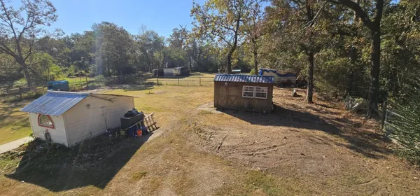 a view of a backyard with sitting area