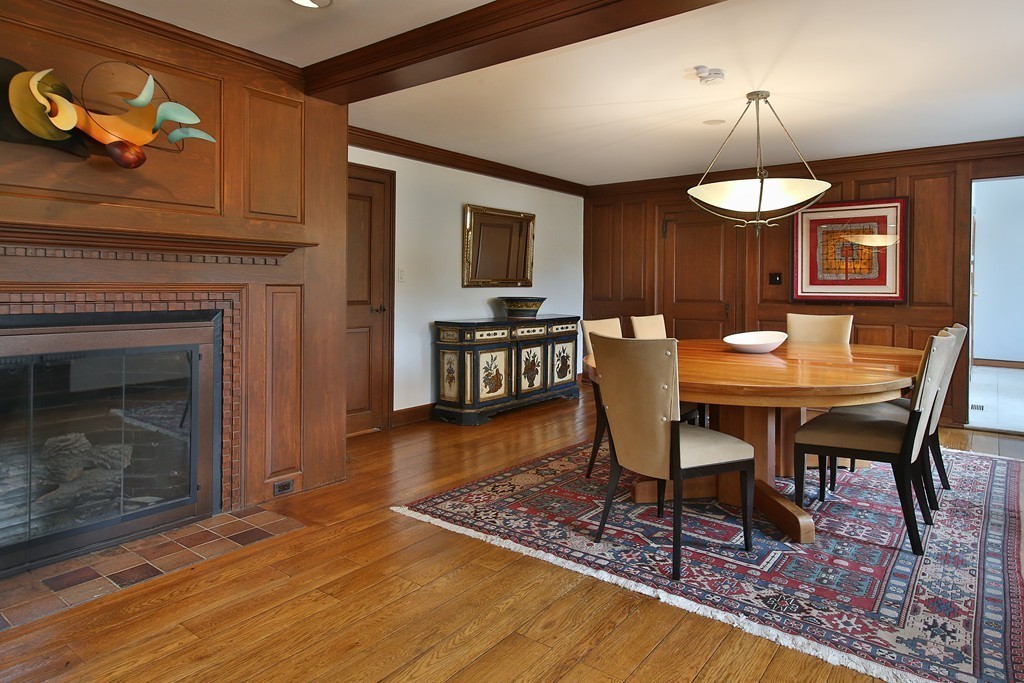 47 Dudley Road Newton, MA 02459 - Photo 5 of 21 a dining room with furniture a fireplace and wooden floor