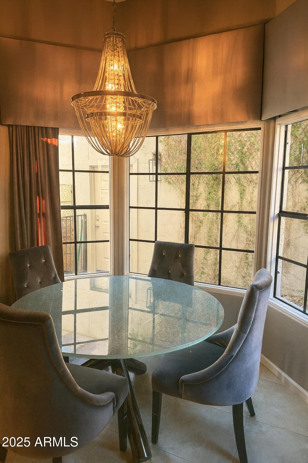 8100 East Camelback Road, Unit 163 Scottsdale, AZ 85251 - Photo 12 of 51 a view of a dining room with furniture and a window