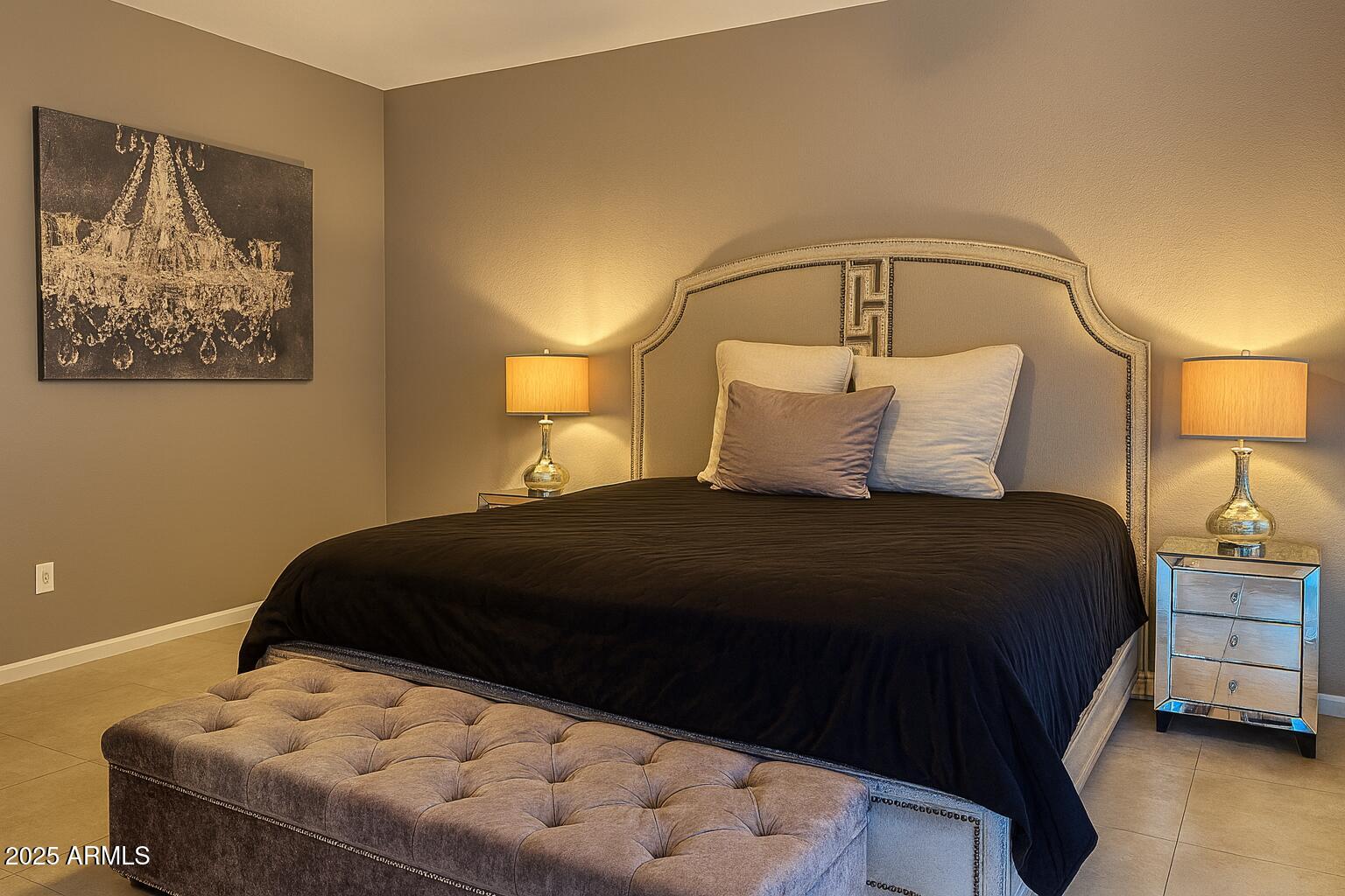 8100 East Camelback Road, Unit 163 Scottsdale, AZ 85251 - Photo 17 of 51 a bedroom with a bed and a lamp on dresser