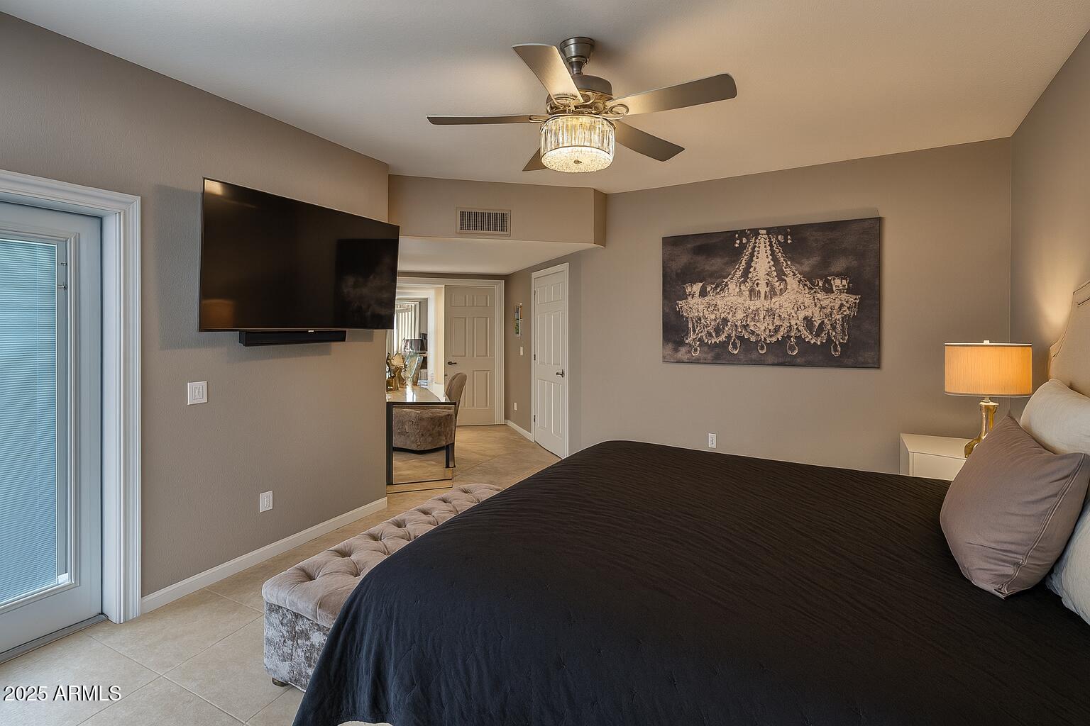 8100 East Camelback Road, Unit 163 Scottsdale, AZ 85251 - Photo 18 of 51 a bedroom with a bed and a flat screen tv