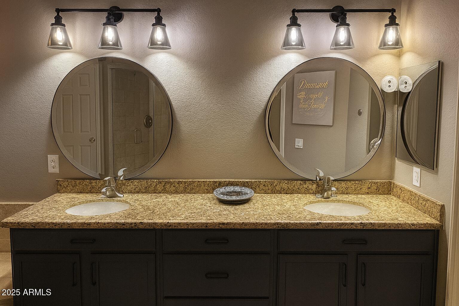8100 East Camelback Road, Unit 163 Scottsdale, AZ 85251 - Photo 21 of 51 a bathroom with a granite countertop double vanity sink and a mirror