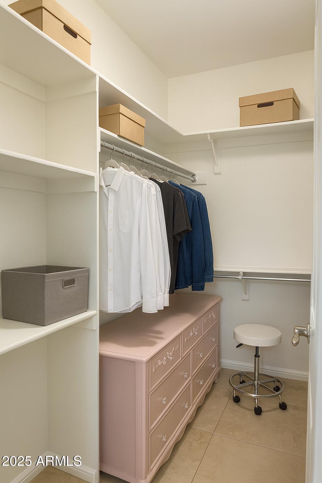 8100 East Camelback Road, Unit 163 Scottsdale, AZ 85251 - Photo 26 of 51 a view of walk in closet with clothes and shoes