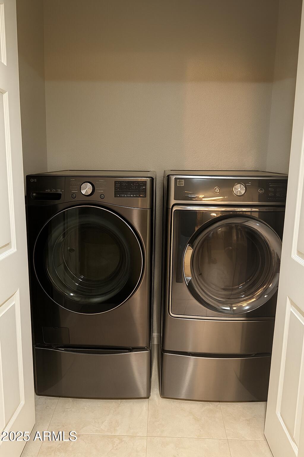 8100 East Camelback Road, Unit 163 Scottsdale, AZ 85251 - Photo 30 of 51 a utility room with dryer and washer