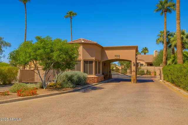 a view of a house and couches in the patio