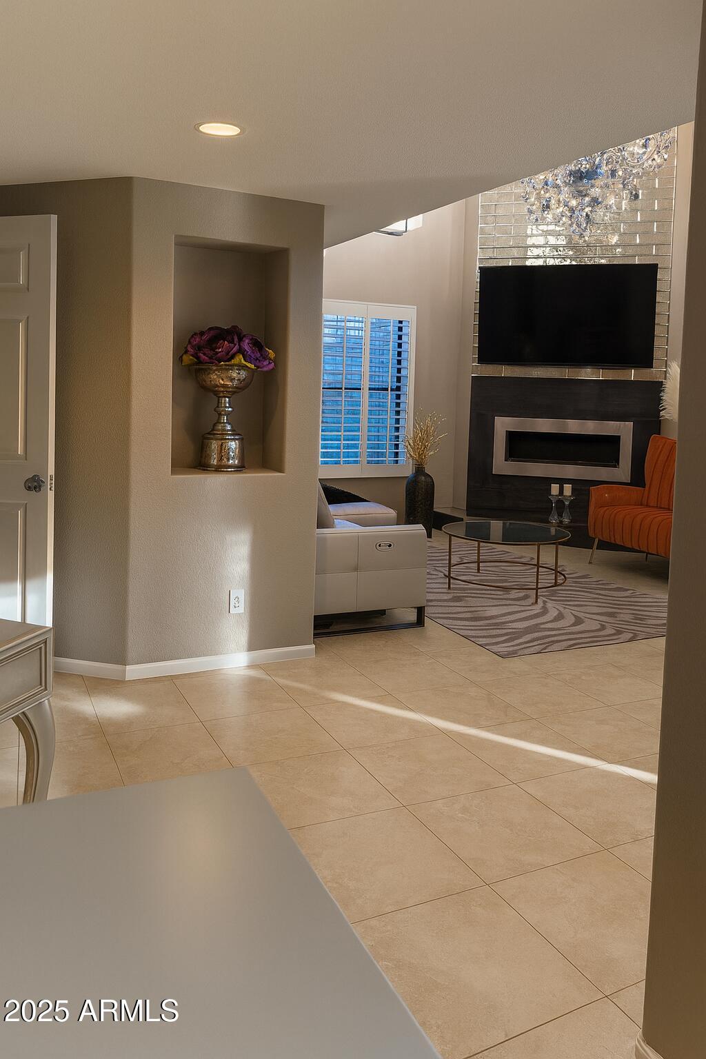 8100 East Camelback Road, Unit 163 Scottsdale, AZ 85251 - Photo 5 of 51 a living room with furniture and a flat screen tv