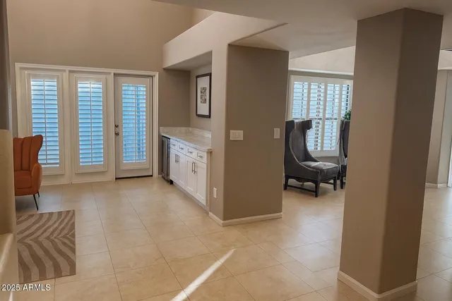 a view of livingroom with furniture and a window