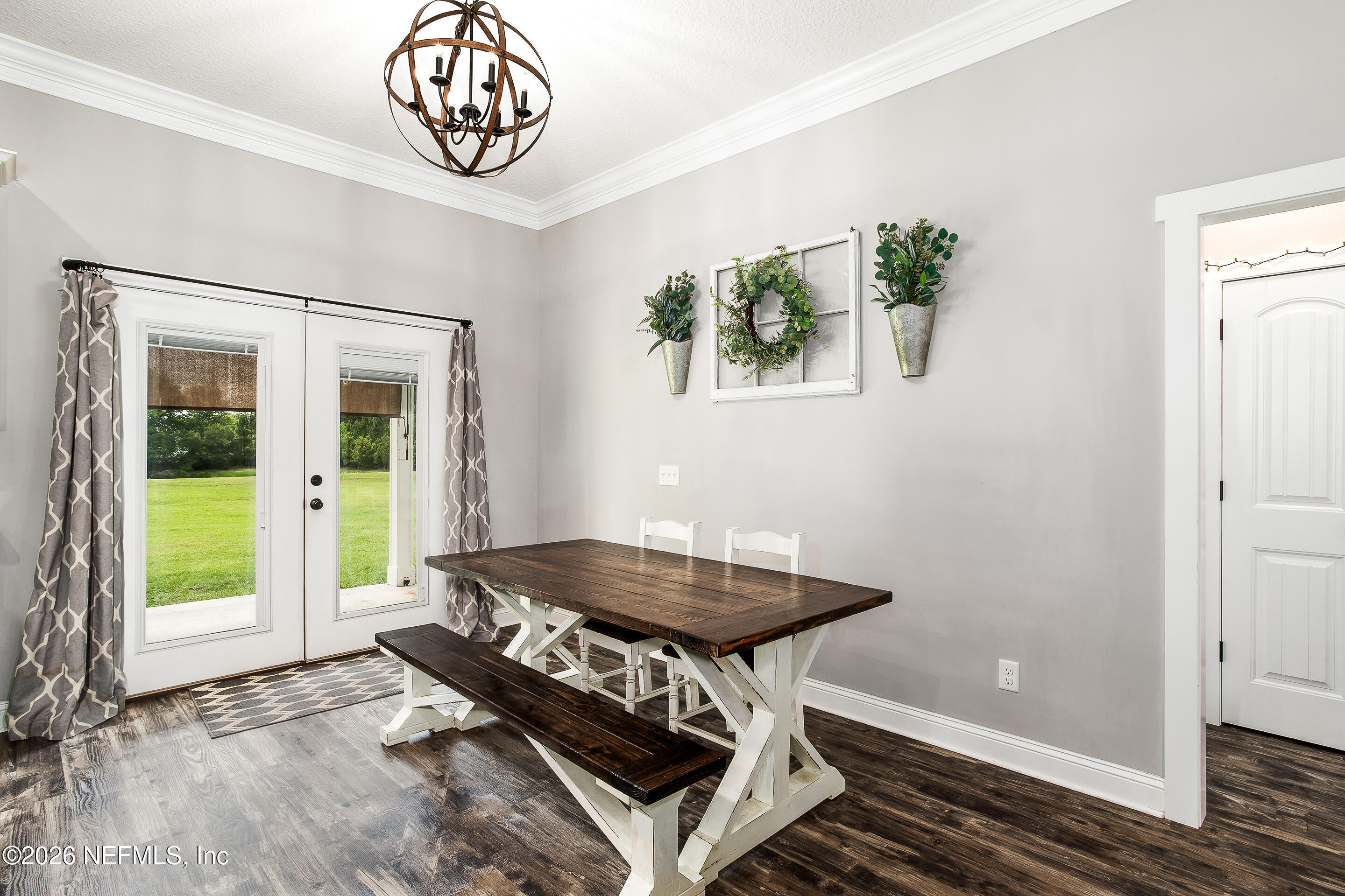 26575 Sheared Stokes Road Hilliard, FL 32046 - Photo 9 of 39 a view of a room with a table and chairs
