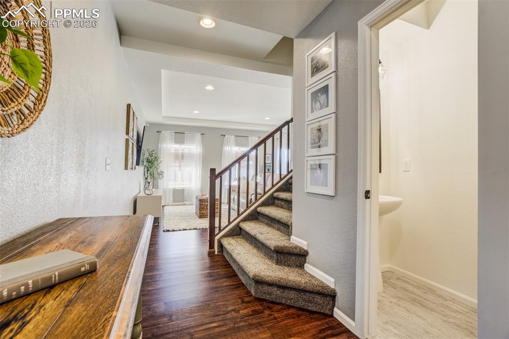 6374 Moate Lane Colorado Springs, CO 80927 - Photo 11 of 42 a view of entryway and hall with wooden floor