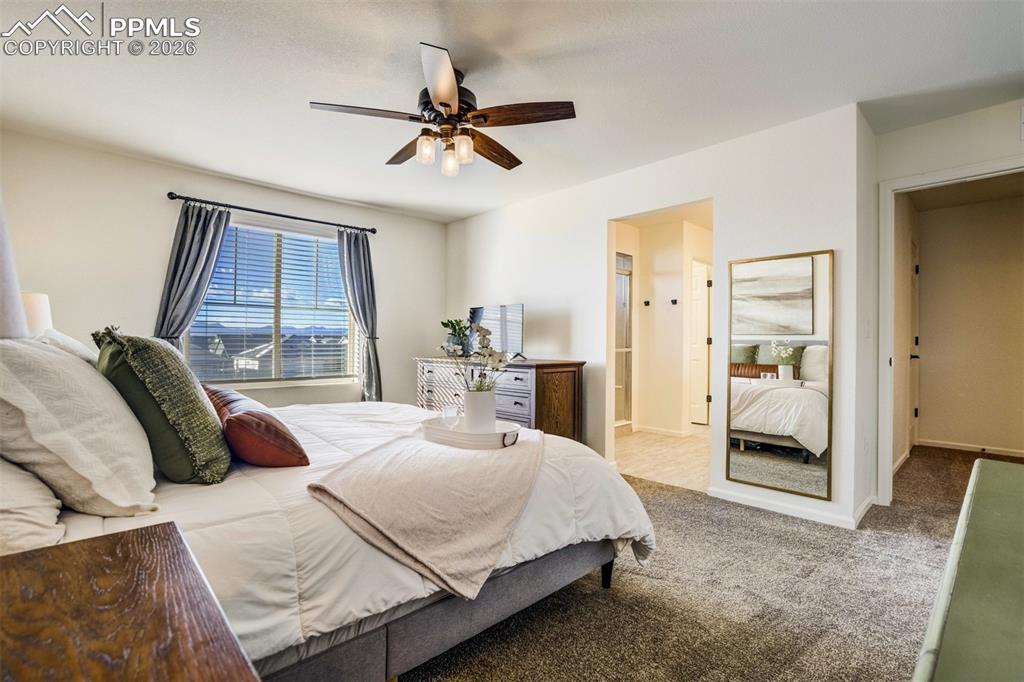 6374 Moate Lane Colorado Springs, CO 80927 - Photo 13 of 42 a bedroom with a bed and window