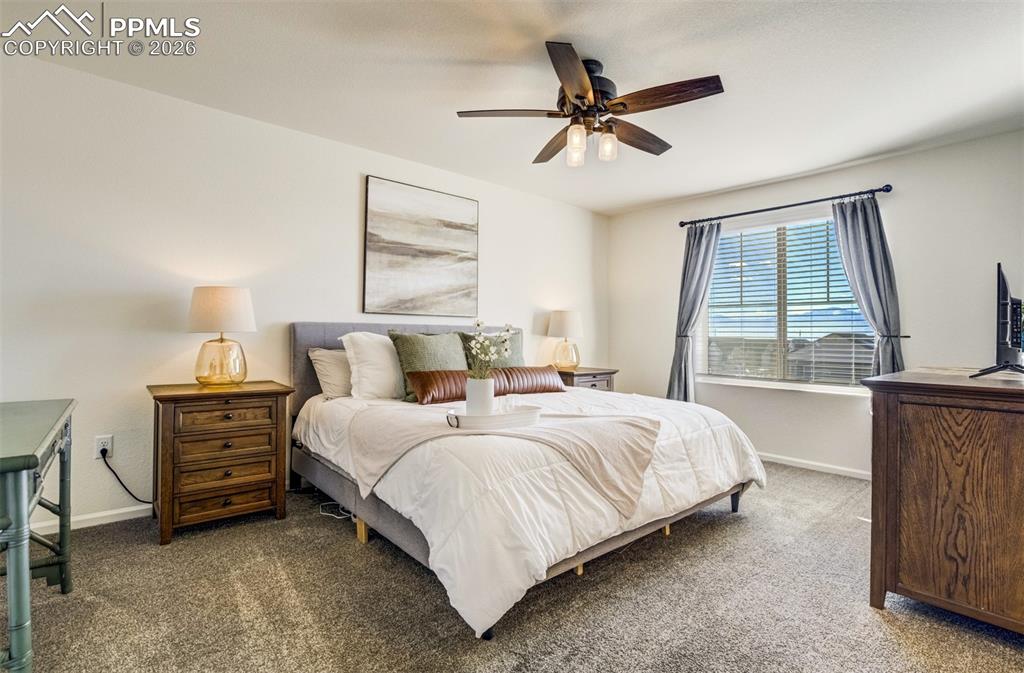 6374 Moate Lane Colorado Springs, CO 80927 - Photo 15 of 42 a bedroom with bed and window