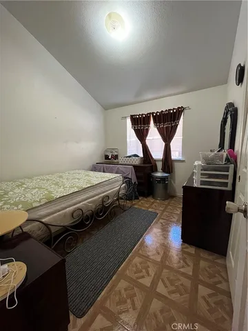 a living room with furniture and a piano