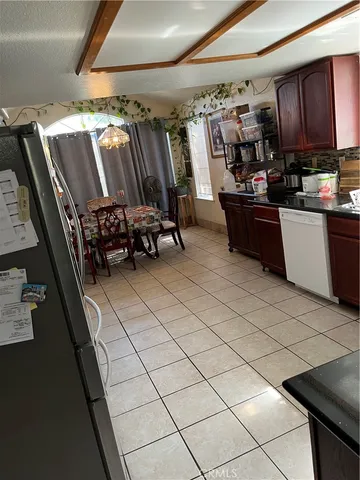 a kitchen with stainless steel appliances a sink and a stove
