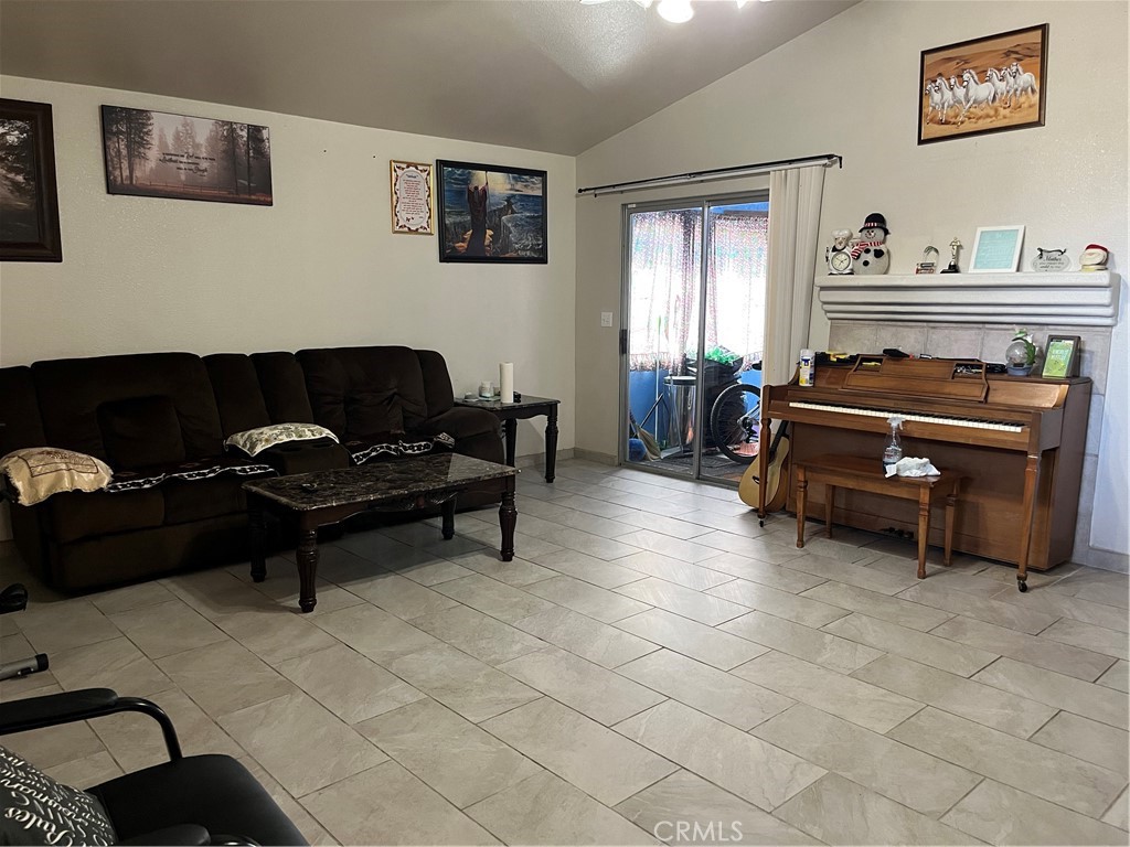740 Hazelhurst Way Coalinga, CA 93210 - Photo 10 of 19 a living room with furniture and a fireplace